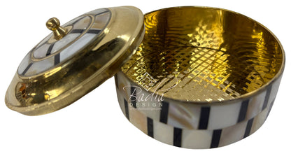 Decorative box with gold interior and lid, featuring a patterned base.