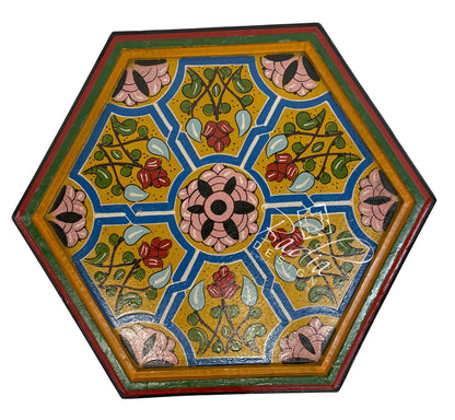 Decorative hexagonal table top with floral patterns on a white background
