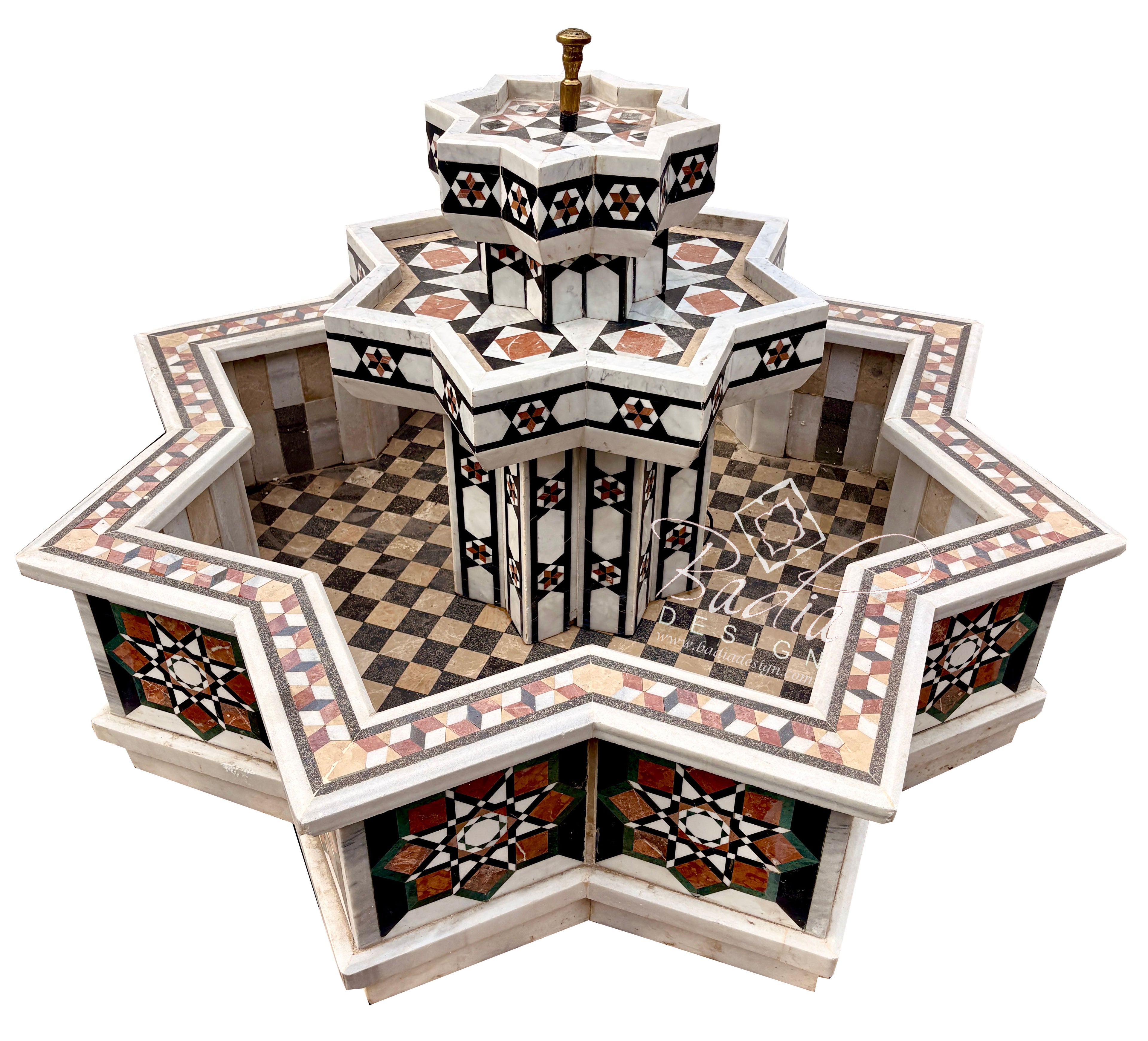 An ornate multi-tiered fountain with intricate geometric mosaic tilework in black, white, beige, and orange, set against a solid white background.