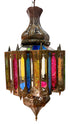An ornate brass hanging lantern with colorful stained glass panels in pink, blue, yellow, and green, isolated on a white background.
