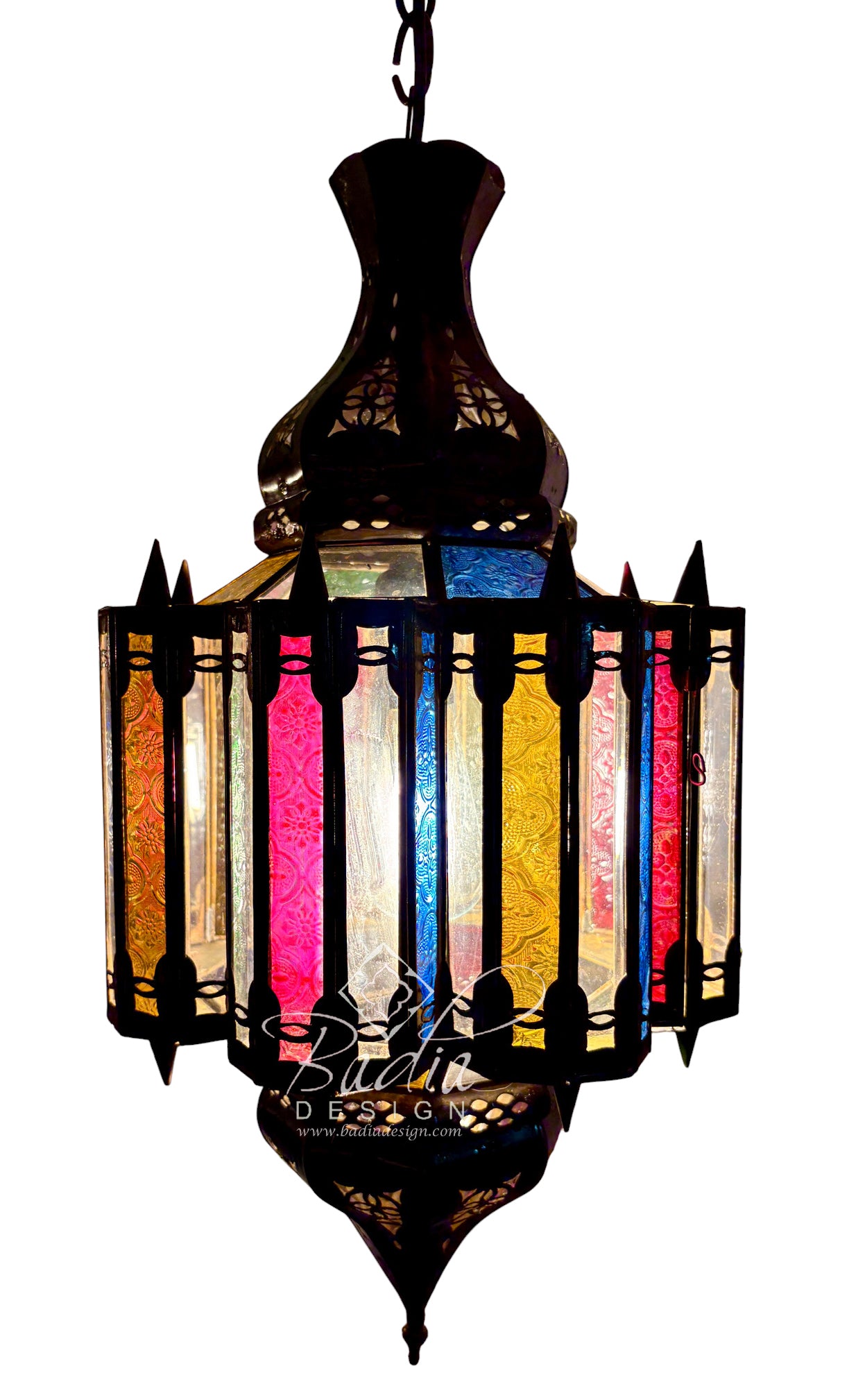 A traditional Moroccan-style hanging lantern with a dark metal frame and multiple vertical stained glass panels in yellow, orange, pink, blue, and white, shown against a plain white background.
