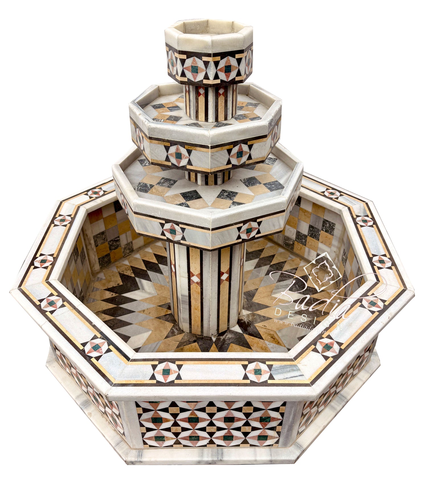 An ornate octagonal stone fountain with tiered levels and intricate geometric mosaic inlay in beige, brown, black, and white, shown on a plain white background.