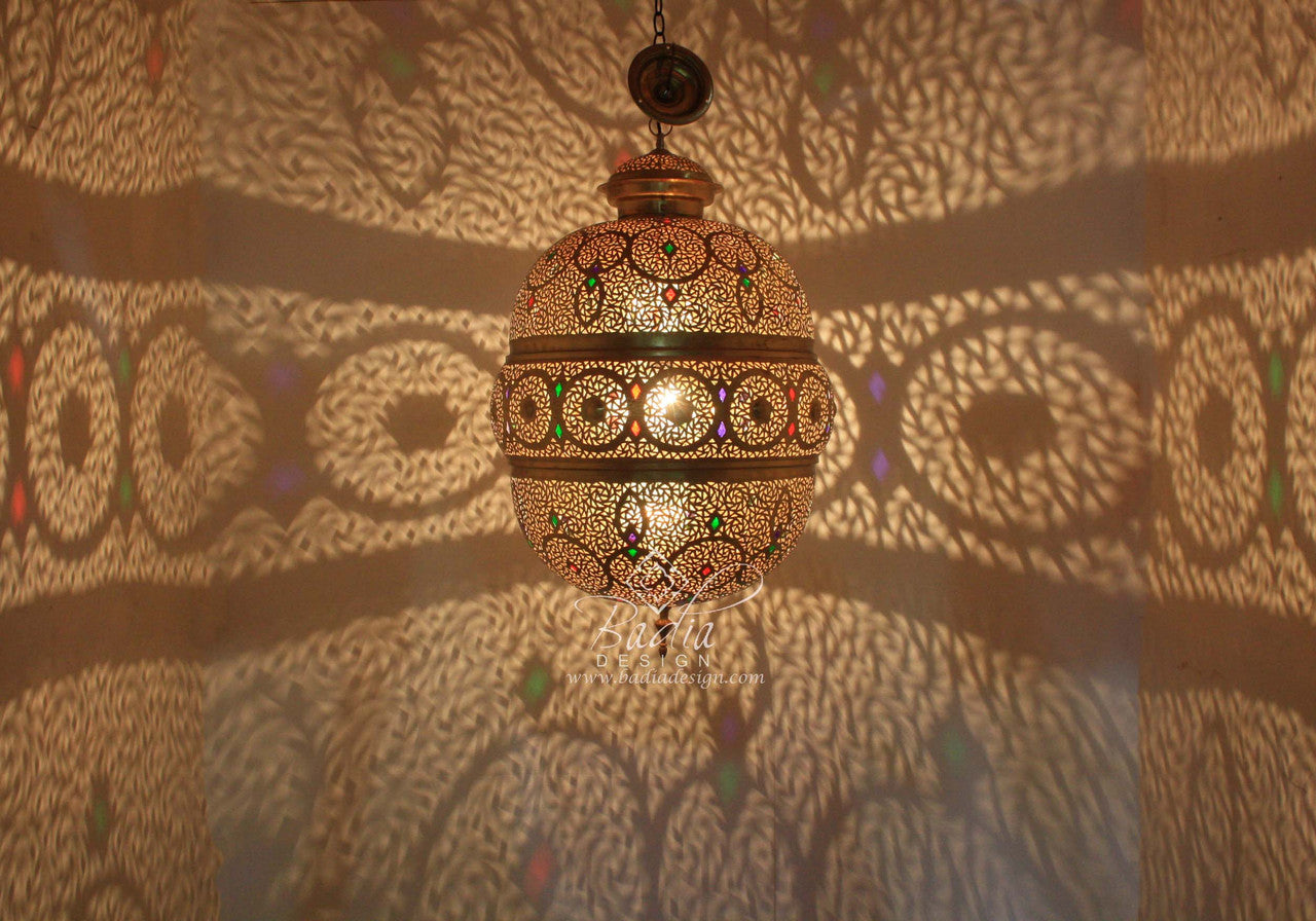 Decorative hanging lamp casting shadows on a patterned wall