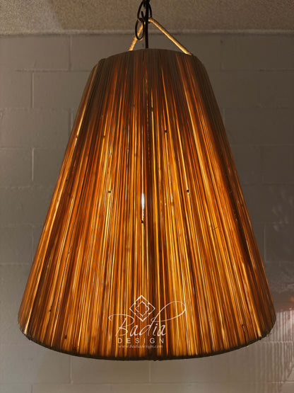 Decorative pendant light with a textured brown shade on a neutral background