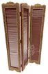 A three-panel folding screen with reddish-brown louvered panels and ornate multicolor floral borders in gold, green, and red, shown on a plain white background.
