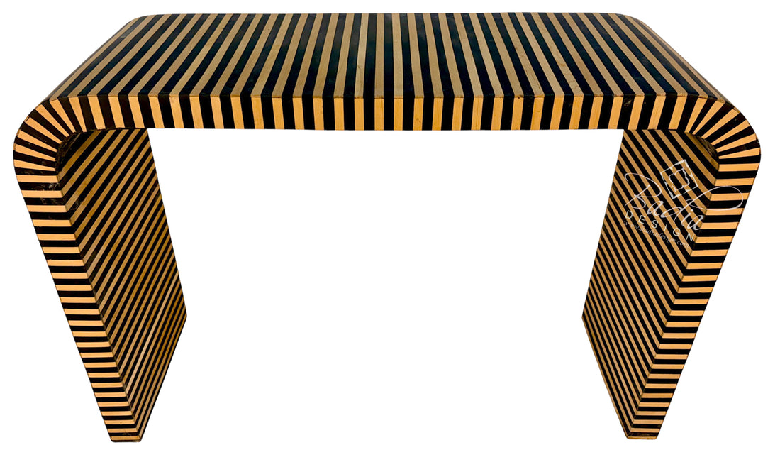 A modern console table with a curved rectangular top and sculptural legs, featuring a glossy striped pattern of black and warm golden-brown wood tones, shown on a plain white background.