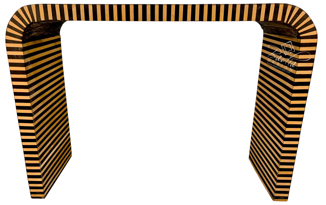 A modern U-shaped console table with a bold black and warm tan striped pattern, shown against a plain white background.