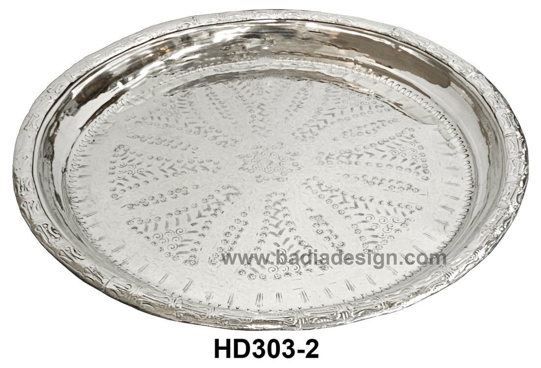 Silver decorative tray with intricate patterns on a white background, featuring the brand &