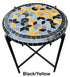 Round mosaic table with black, yellow, and blue geometric pattern on a white background