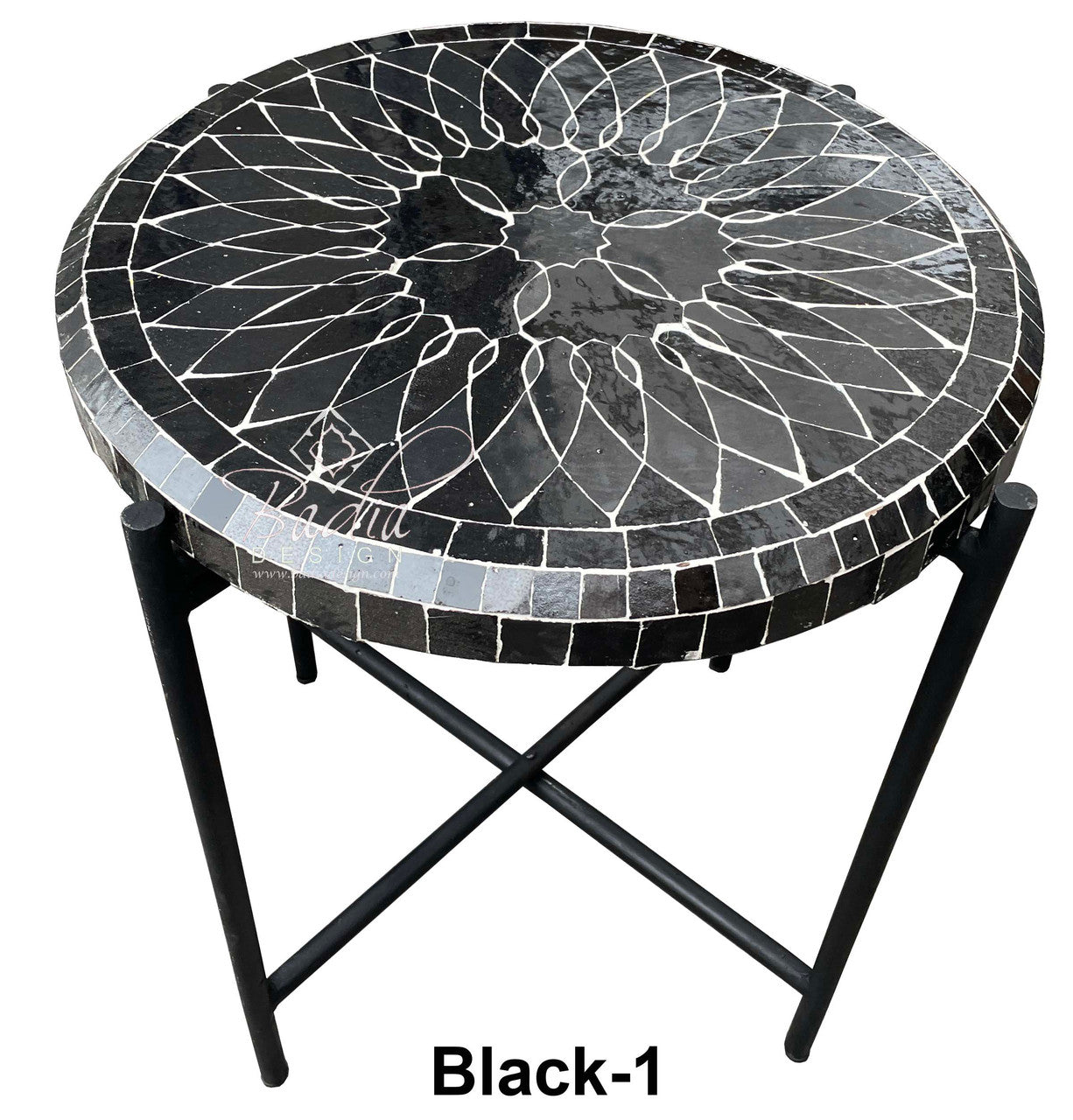 Round mosaic table with black and gray pattern on a white background