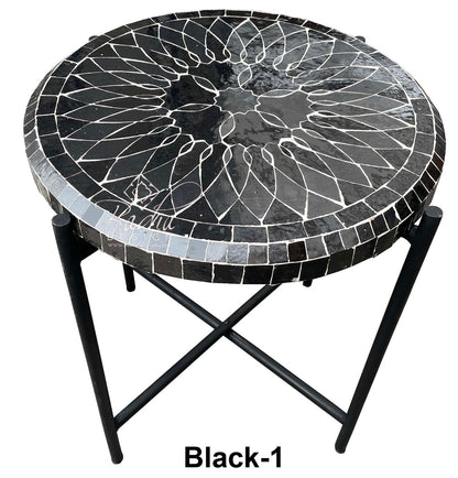 Round mosaic table with black and gray pattern on a white background