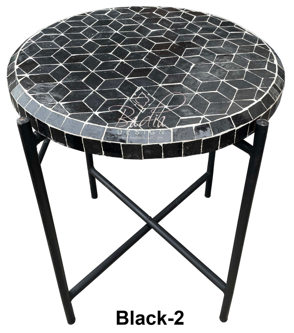 Round mosaic table with black geometric pattern on a white background