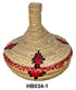 Woven basket with red and black patterns on a white background