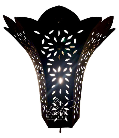 A black metal wall sconce with a sculptural, lotus-like silhouette and intricate laser-cut floral patterns, shown against a plain white background with a watermark at the bottom.