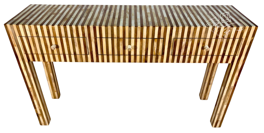 A console table with a striped inlay design in shades of brown and beige, featuring three drawers with round knobs and four tapered legs, shown against a plain white background.