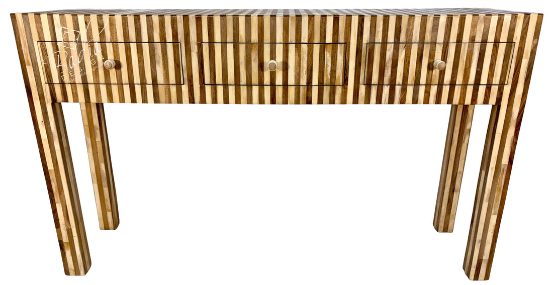 A modern console table featuring a striped pattern of light and dark wood inlays, three drawers with round knobs, and four tapered legs, shown against a plain white background.
