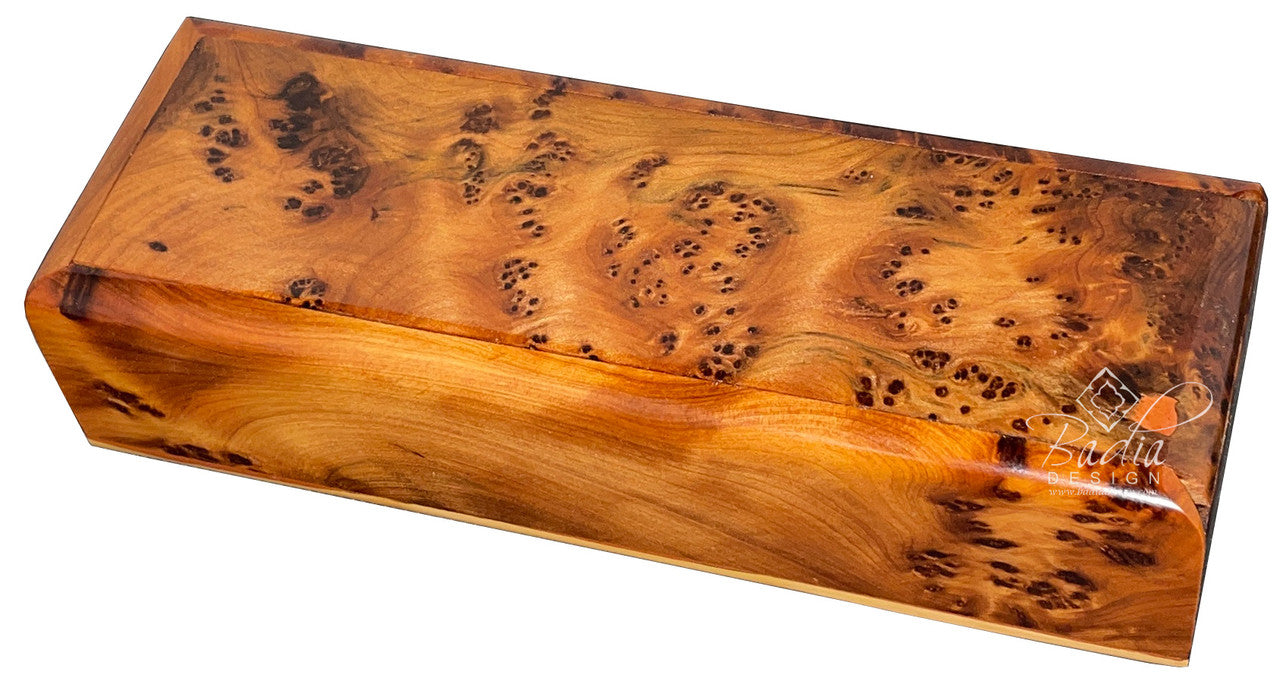 Wooden box with a burl pattern on a white background
