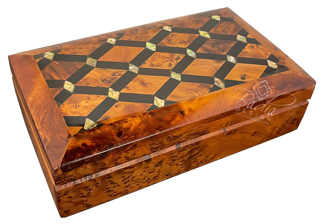 Wooden jewelry box with intricate inlay design on a white background