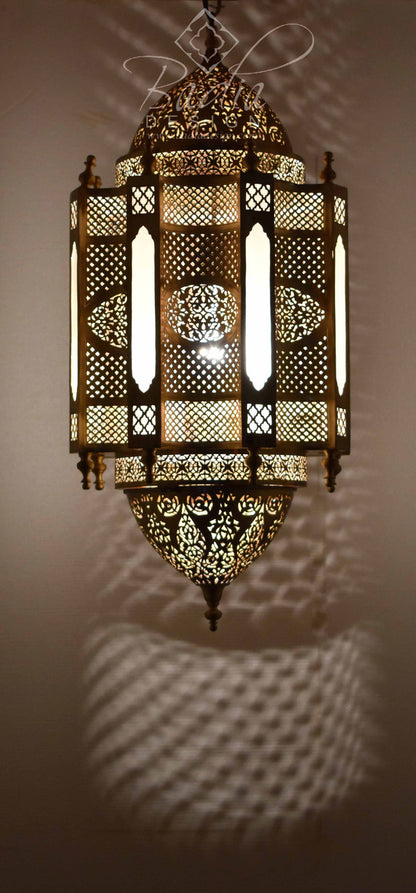 Decorative wall-mounted light fixture with intricate patterns on a plain background
