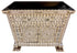 An ornate rectangular cabinet with a black top and legs, covered in intricate mother-of-pearl and gold inlay patterns, shown on a white background.