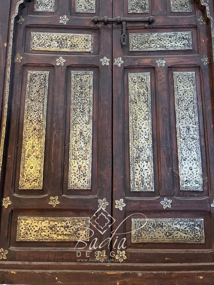 Arched Wooden Double Door with Intricate Metal Design