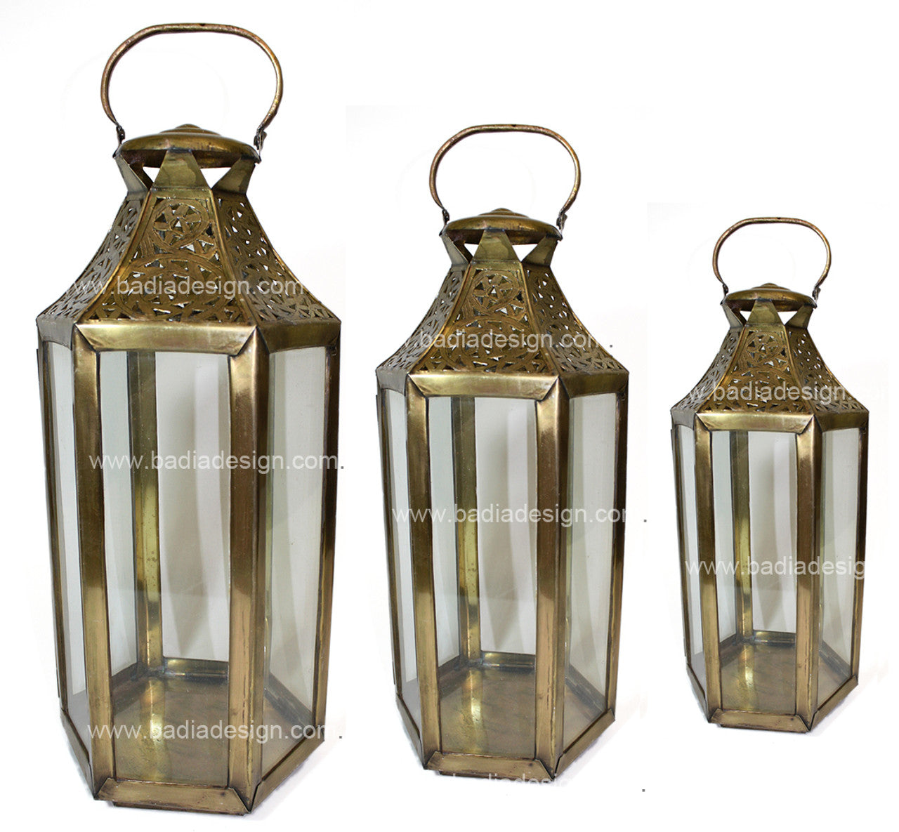 Three brass lanterns of different sizes on a white background with &