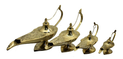 Set of four brass genie lamps on a white background