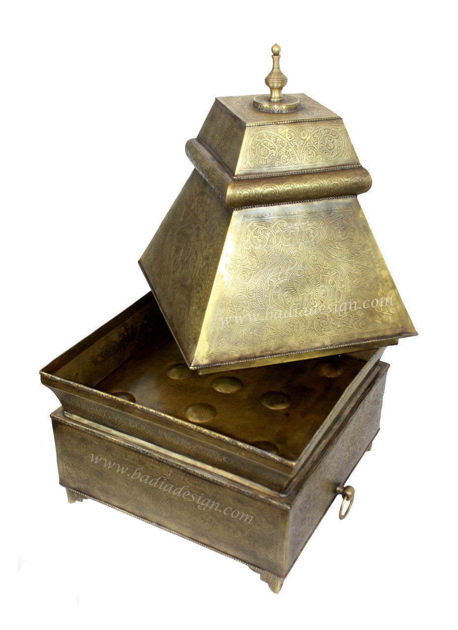 Bronze decorative item with a pyramidal top on a white background