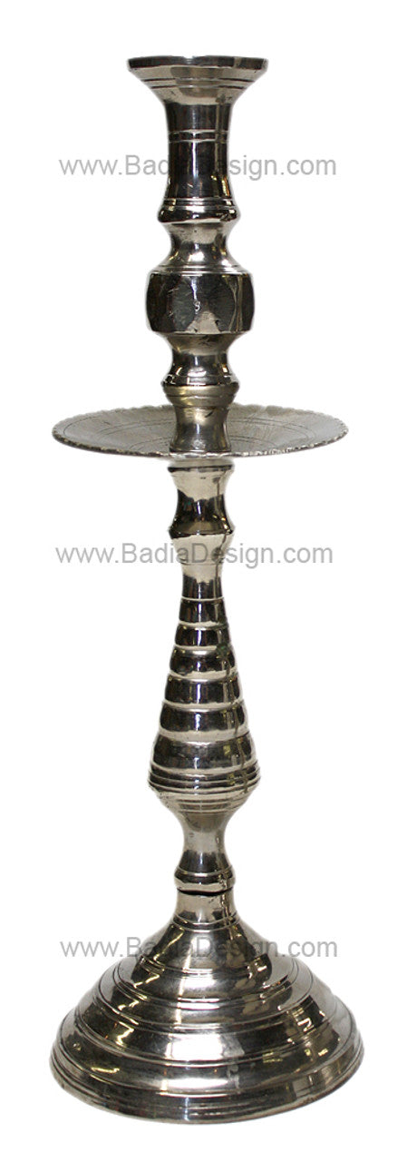 Silver candle holder with intricate design on a white background