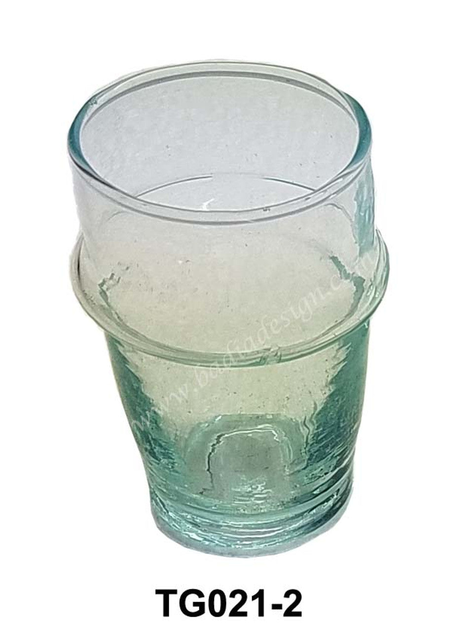 Stack of clear glass tumblers on a white background with &