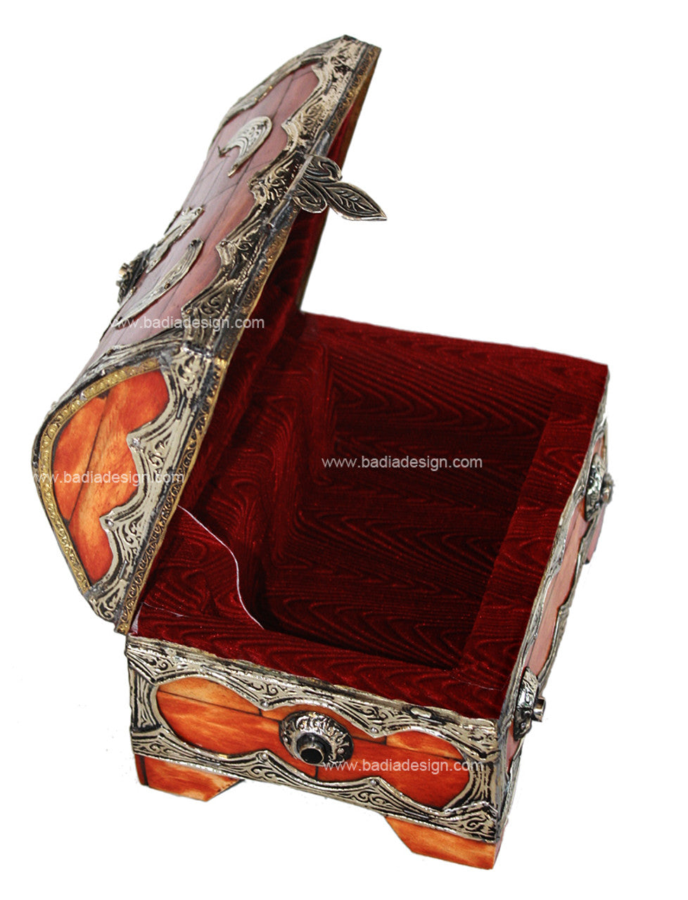 Decorative jewelry box with intricate designs on a white background