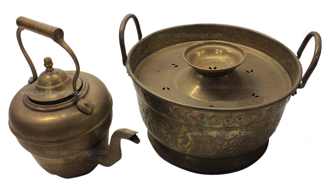Two brass cookware items on a white background