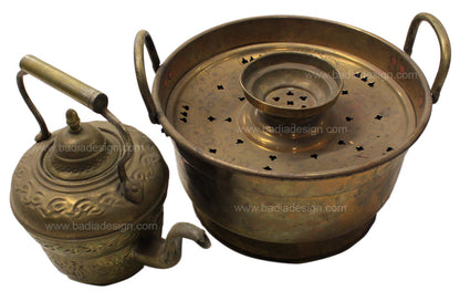 Bronze lamp and steamer set on a white background