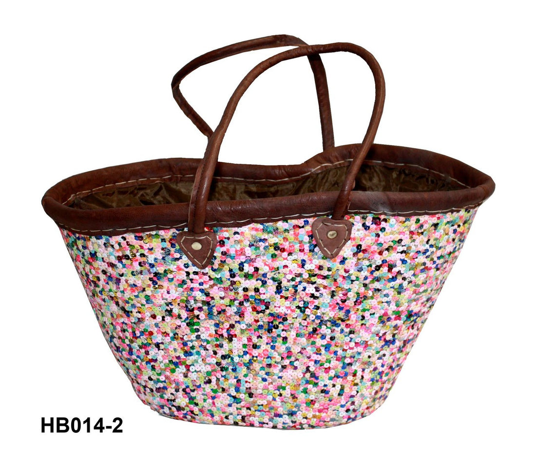 Multicolored speckled bag with brown handles on a white background