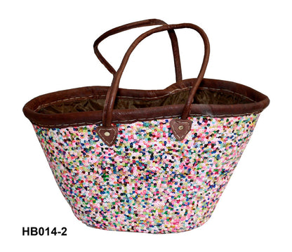 Multicolored speckled bag with brown handles on a white background