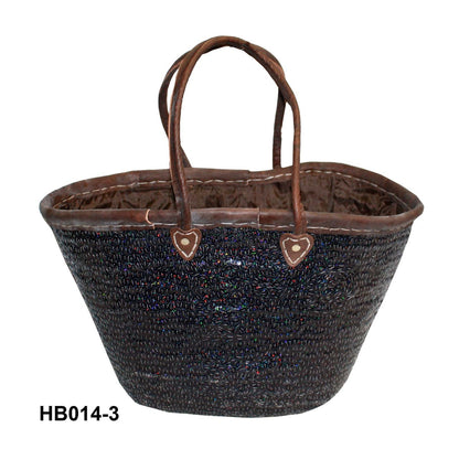 Woven basket with brown handles on a white background
