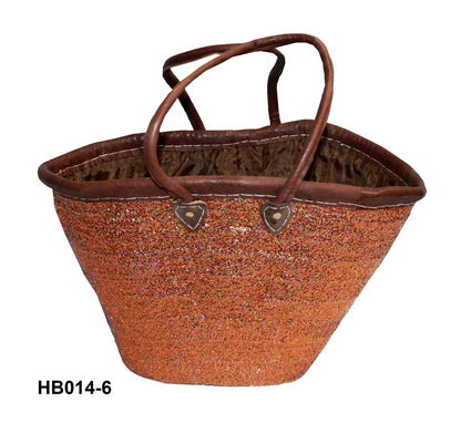 Brown woven basket with handles on a white background