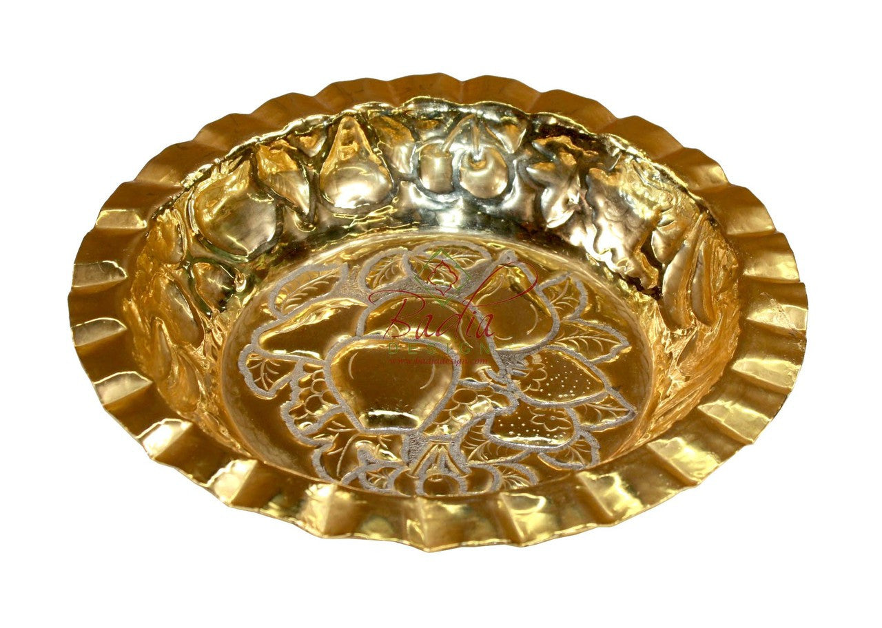 Gold decorative bowl with intricate designs on a white background