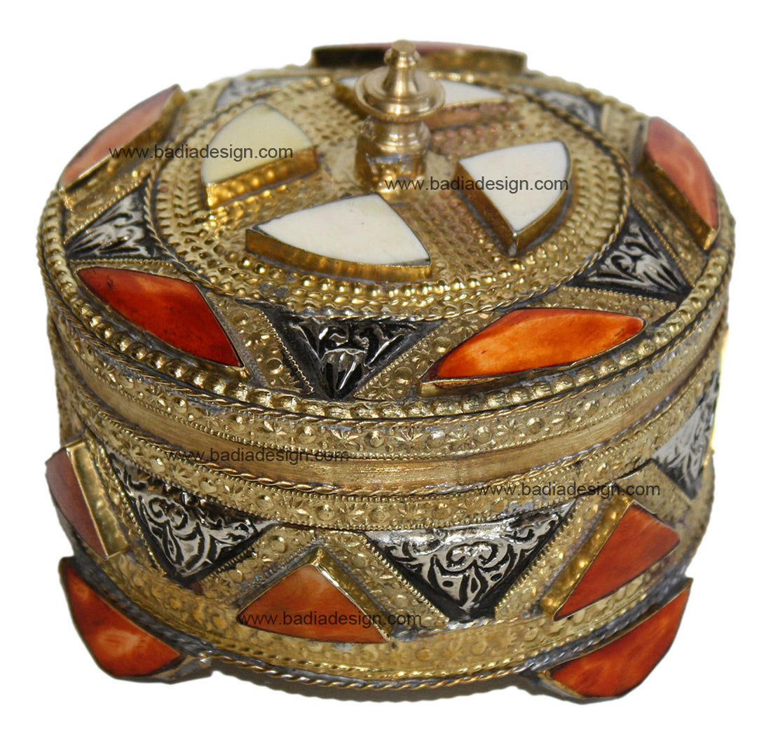 Decorative round box with gold, silver, and red accents on a white background