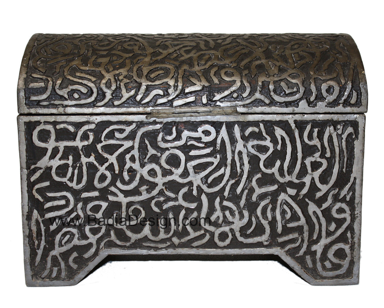 Decorative metal box with intricate carvings and Arabic calligraphy on a white background