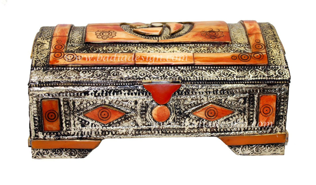 Decorative wooden box with intricate patterns on a white background