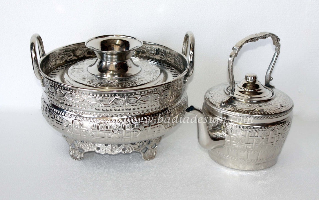 Silver tea set with teapot and tea tray on a white background