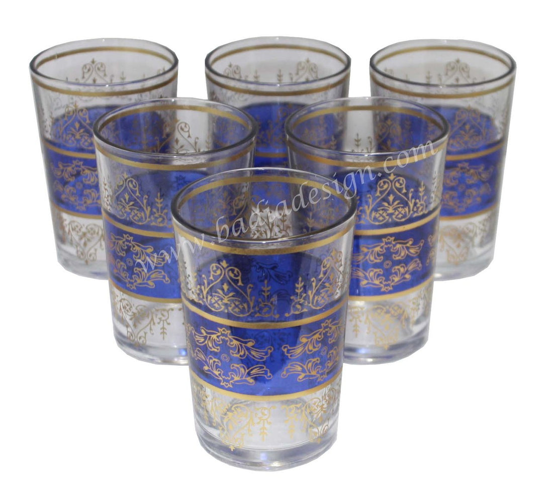 Set of six tea glasses with blue and gold decorative patterns on a white background.