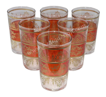 Set of six tea glasses with orange and gold decorative patterns on a white background.