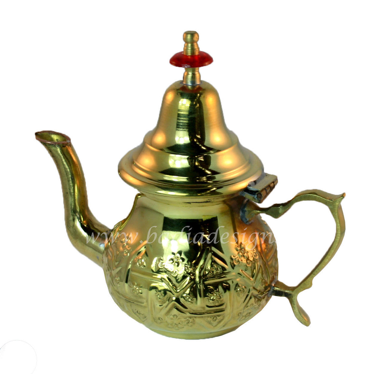 Gold teapot with intricate designs on a white background