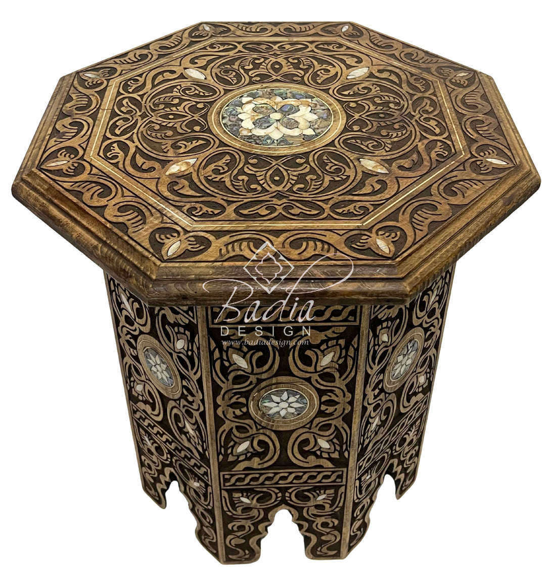 Decorative wooden side table with intricate patterns on a white background