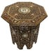 Decorative wooden side table with intricate patterns on a white background