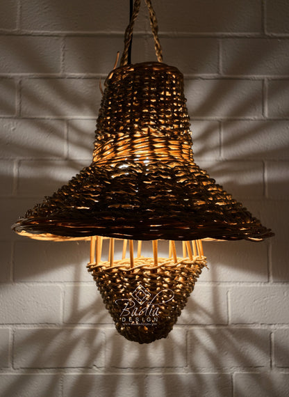 Woven pendant light hanging against a textured wall