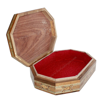 Wooden jewelry box with red interior on a white background