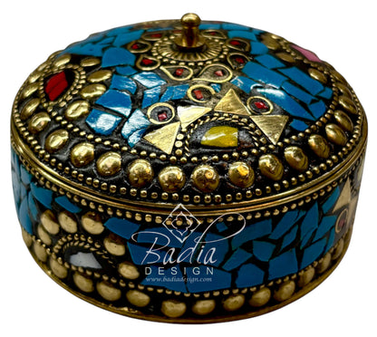 Decorative jewelry box with mosaic design and gold accents, featuring the Badia Design logo.